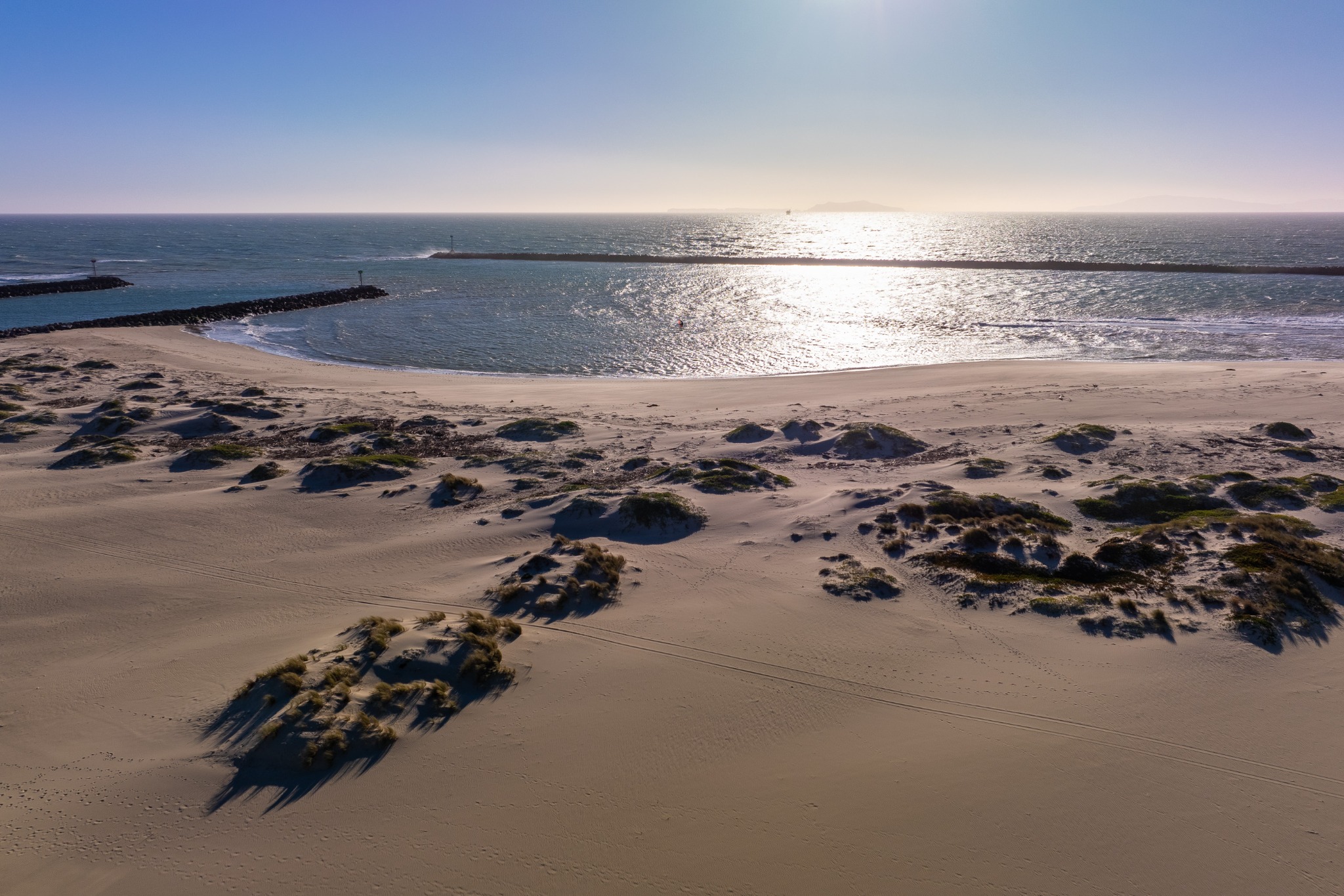 Daytime view of Channel Islands Harbor entrance and breakwaters in Oxnard