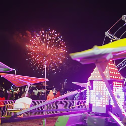 Fireworks and illuminated rides at a previous Ventura Harbor holiday celebration